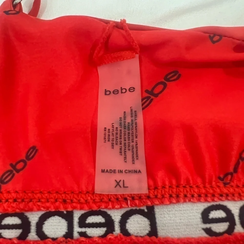 Bebe blood orange red swimsuit black band with logo size XL